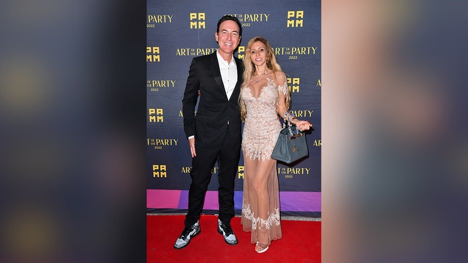 jason ader with wife smiling