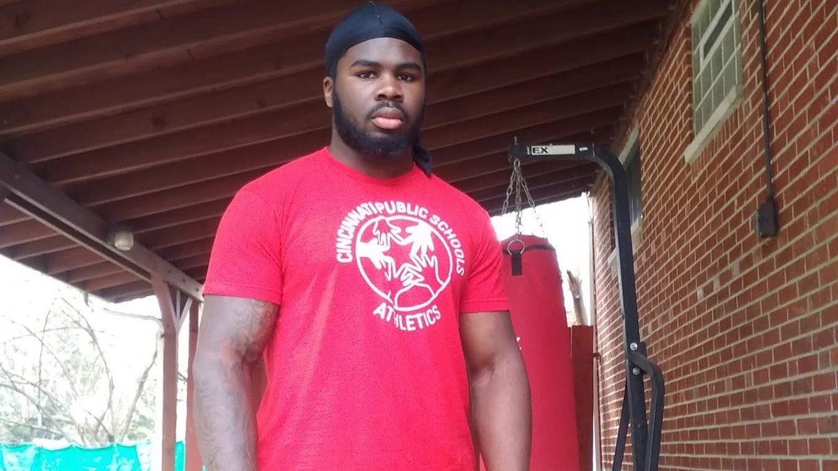 McAdrian Martin in a red shirt