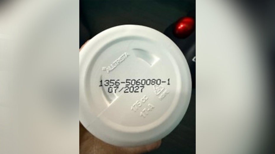 lot code printed on bottom of white bottle