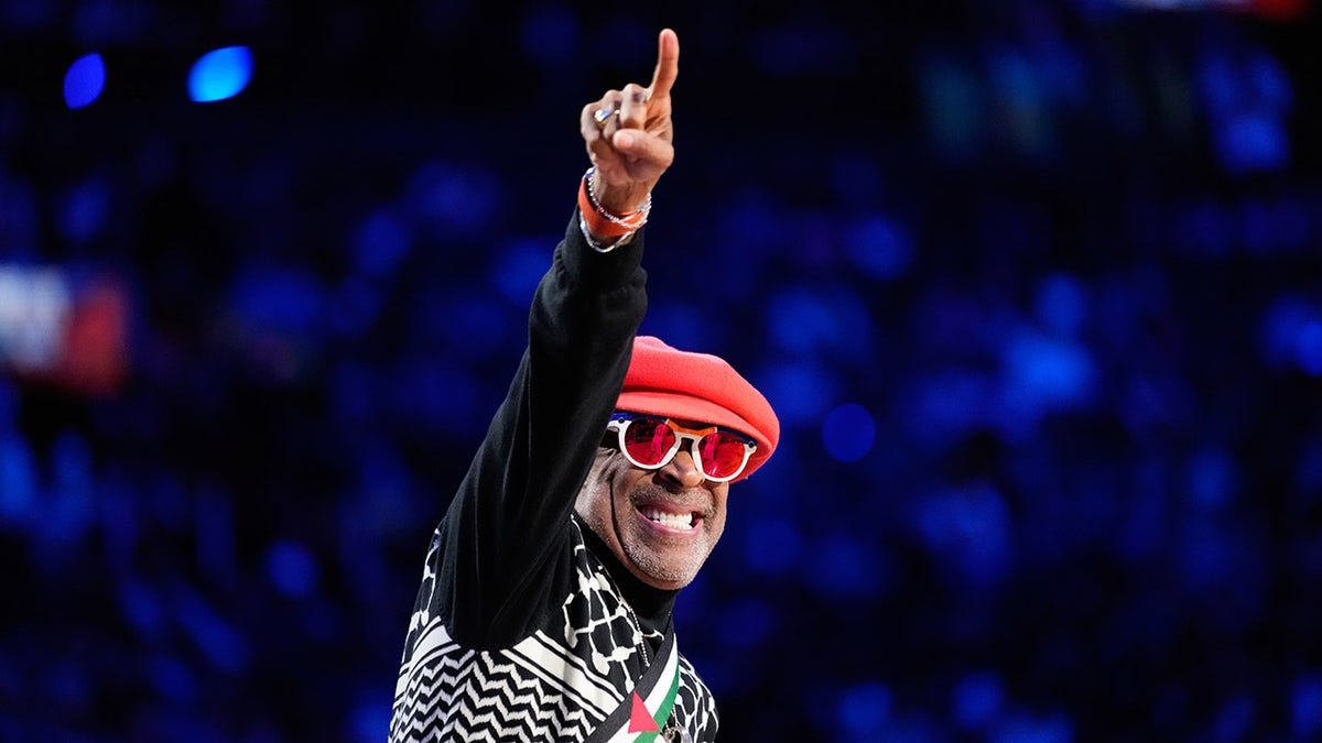 Spike Lee points down the court