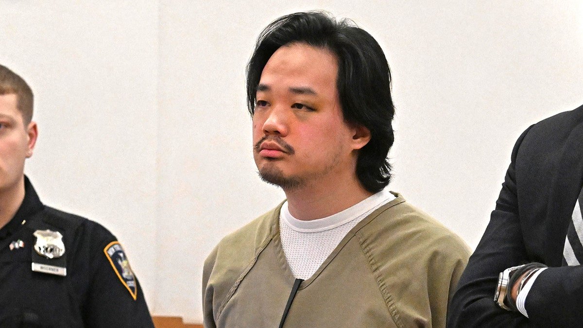 Jeopardy contestant Winston Nguyen standing in a courtroom with a visible bruise under his eye.