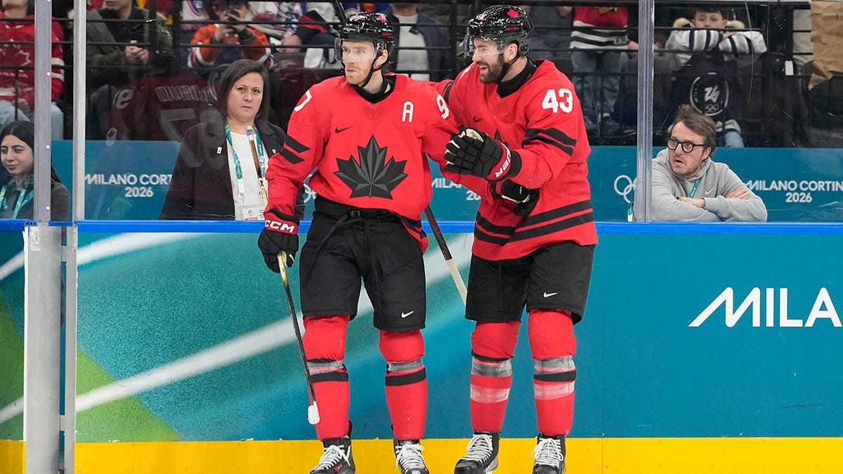 Connor McDavid and Tom Wilson celebrate