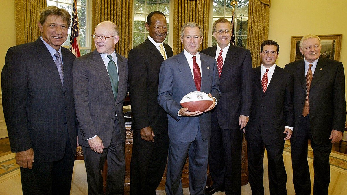 George W. Bush poses