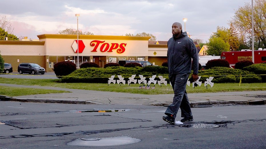 Evening light shines on a supermarket building in Buffalo two days after a deadly mass shooting.