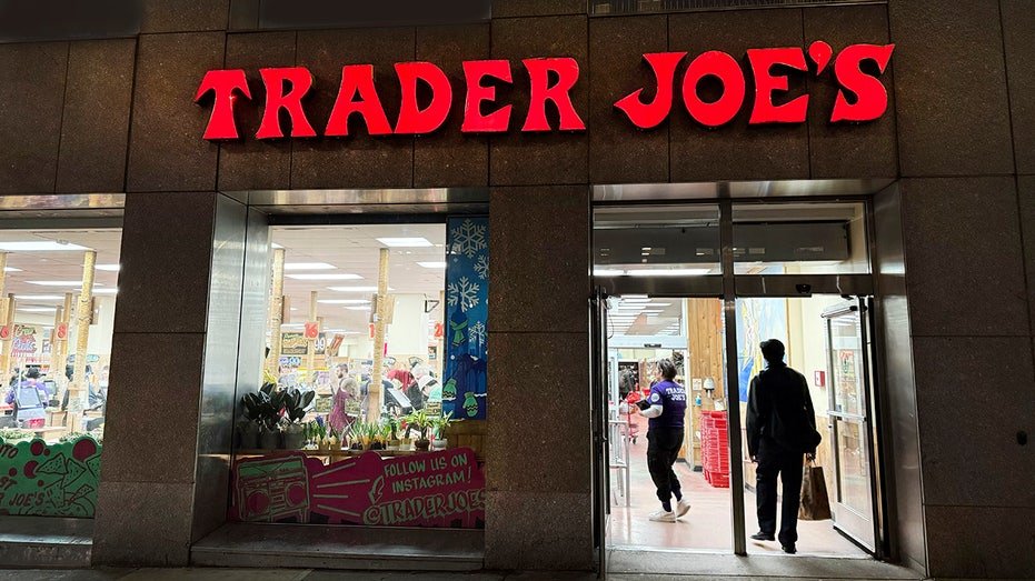 Trader Joe's grocery store, building exterior and entrance at night, New York City, New York, USA