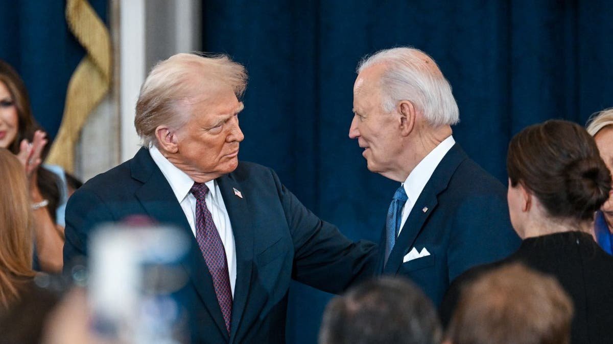 Trump shakes hands with Biden