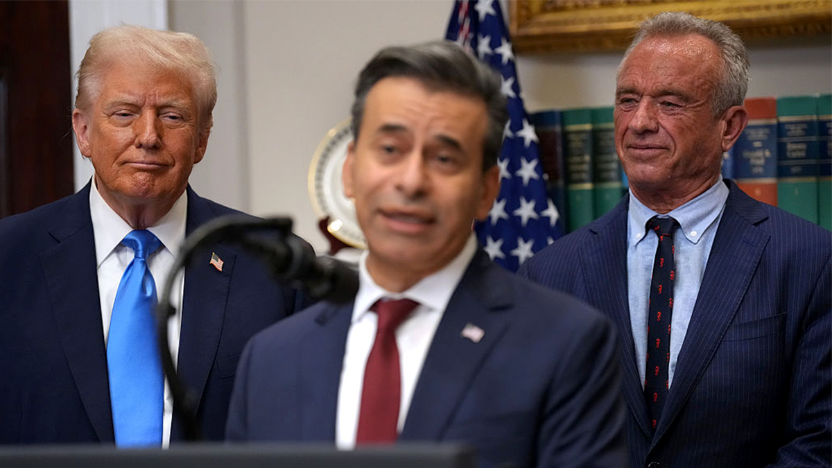 President Donald Trump and Health and Human Services Secretary Robert F. Kennedy Jr. look on as Food and Drug Administration Commissioner Dr. Marty Makary speaks