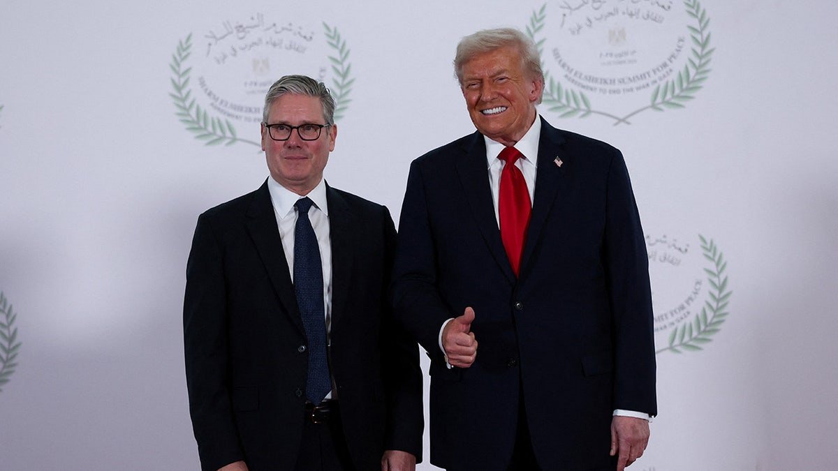 U.S. President Donald Trump and British Prime Minister Keir Starmer pose for a photo, at a world leaders' summit on ending the Gaza war.
