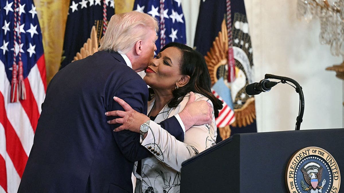 President Trump and Alice Marie Johnson greet one another
