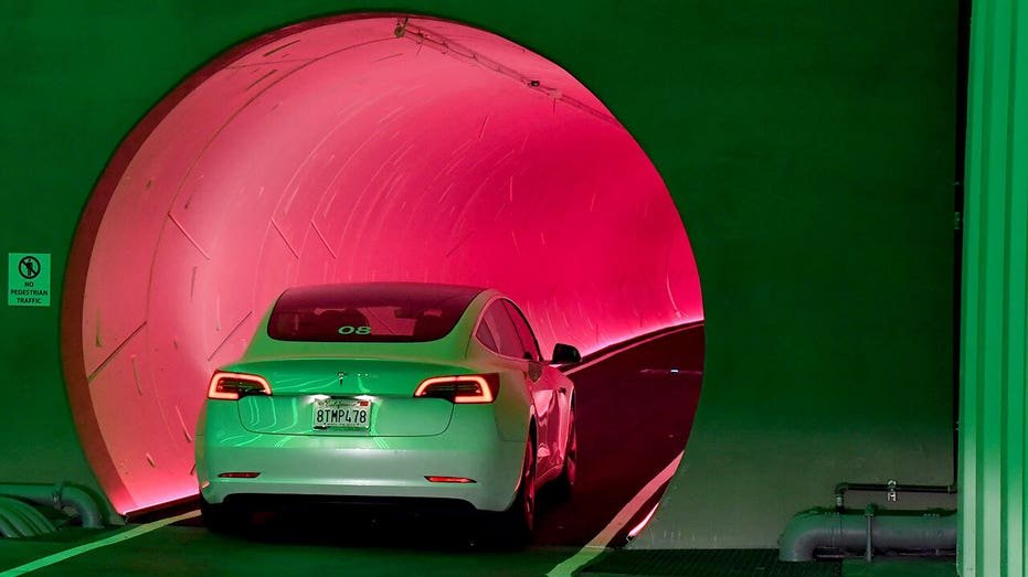 Tesla vehicle entering a tunnel.
