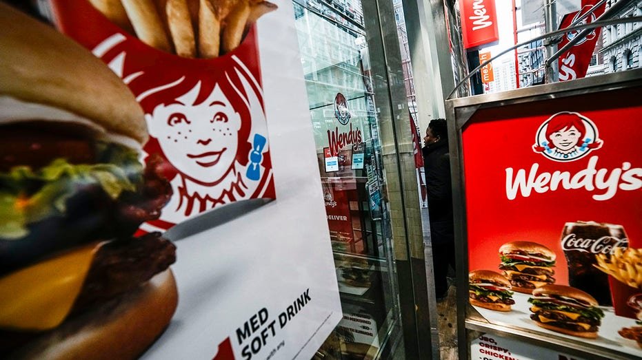 A customer goes into one of the Wendy's restaurants in lower Manhattan.