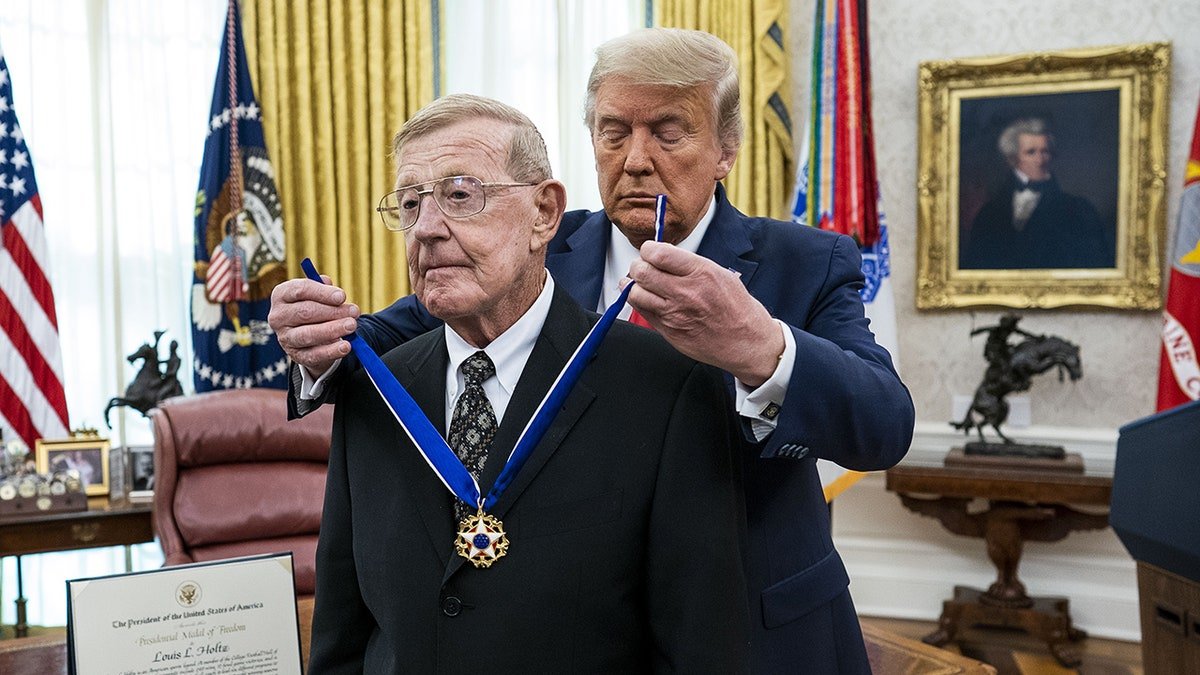 Donald Trump presents Lou Holtz