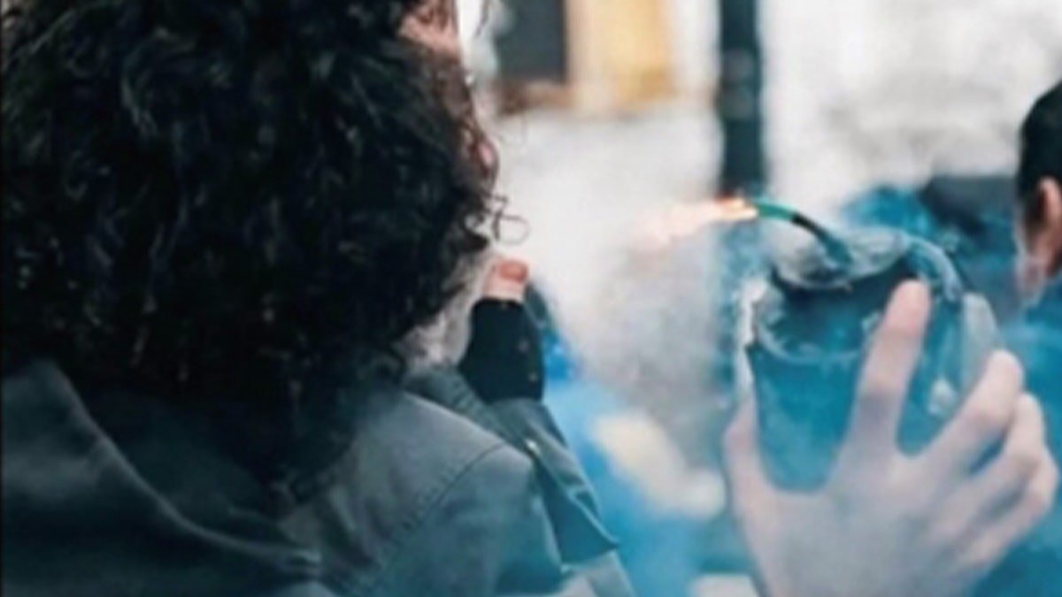 Suspect holding bomb.