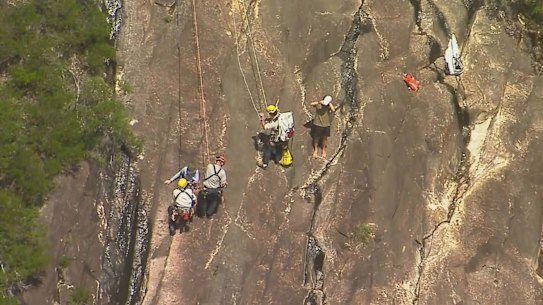 Search and rescue crews retrieved a pair of 18-year-old hikers who fell down a cliff face on Mount Beerwah on Sunday.
