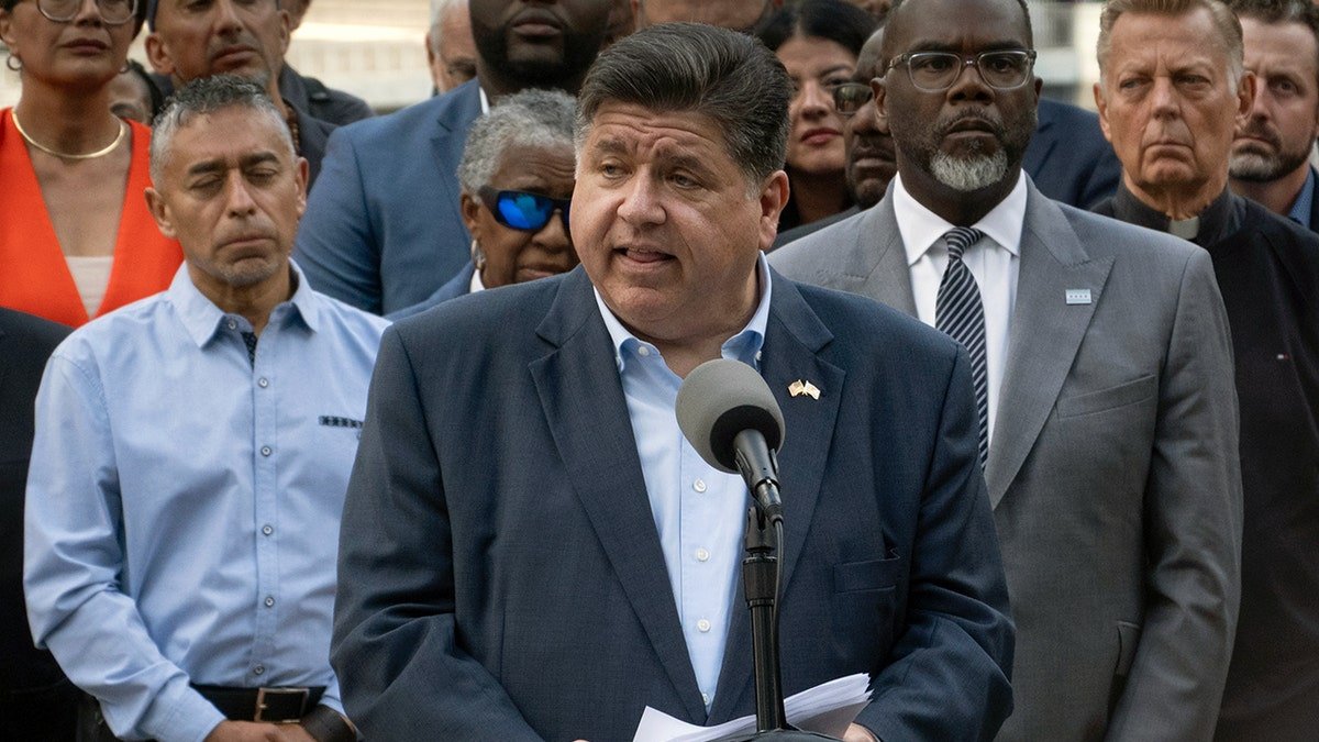 Pritzker at a press conference