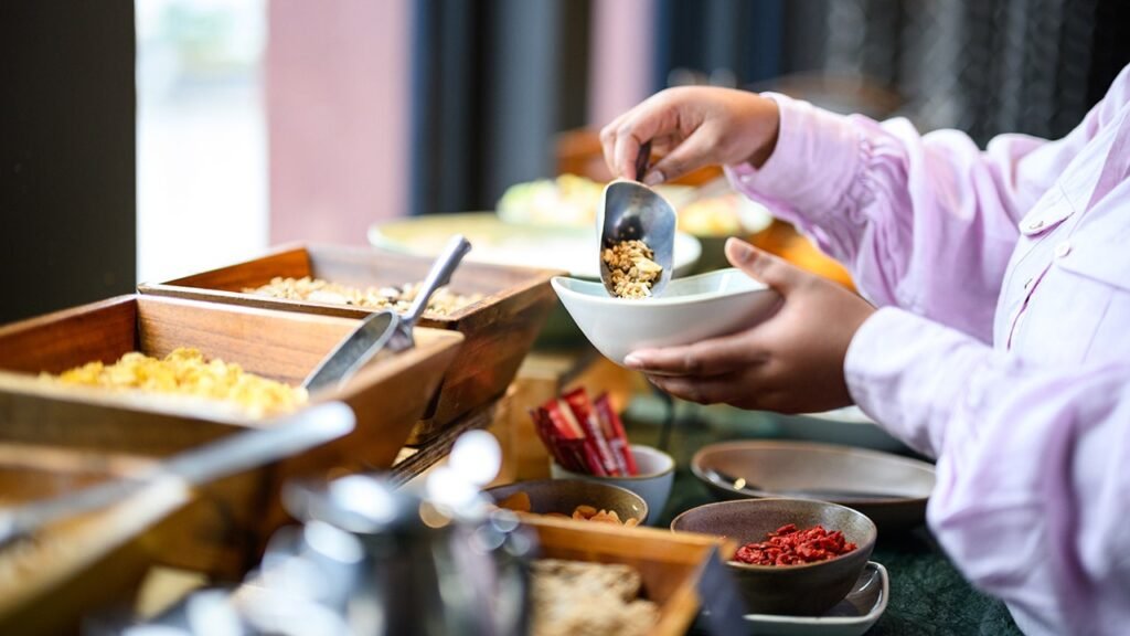 Hotel buffet crashers caught on camera loading up plates, walking out without paying Hotel buffet crashers caught on camera loading up plates, walking out without paying