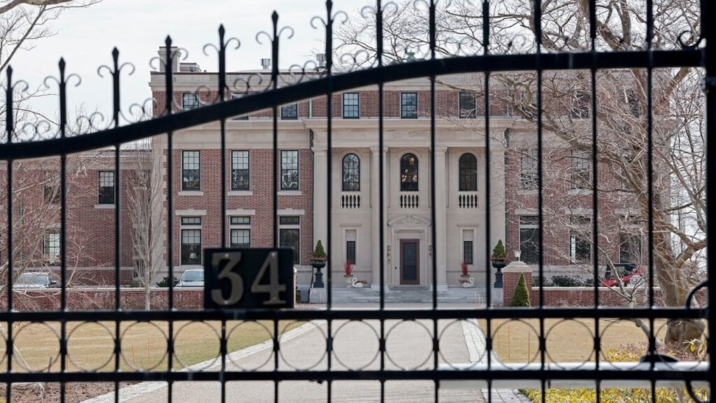 Police hunt armed suspect after housekeeper bound, attacked in luxury mansion heist: report