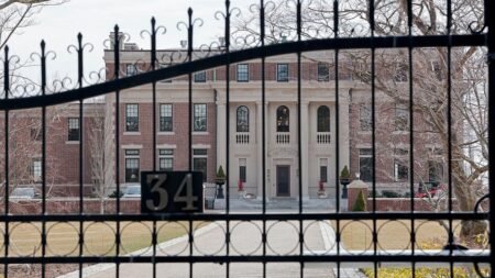 Police hunt armed suspect after housekeeper bound, attacked in luxury mansion heist: report