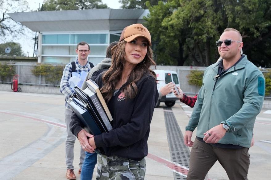 Noem boarding a plane during a trip to Buenos Aires, Argentina on July 29, 2025.