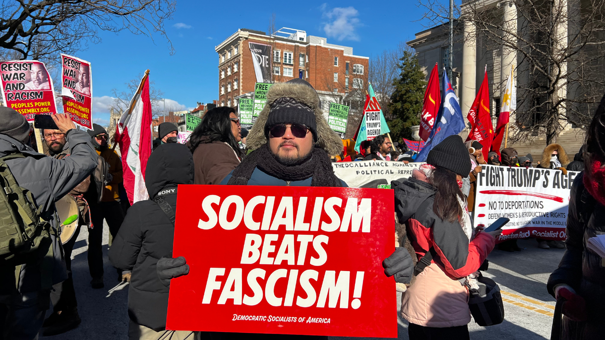 In an anti-Trump march, Democratic Socialists of America members carried signs against "fascism."