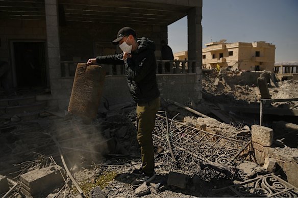 Adam Shreif in the rubble of his family’s home, which was destroyed by an Israeli airstrike in Douris, Lebanon.