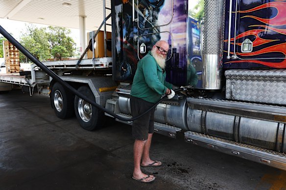 Truck owners like Chris Gibbs, shown here filling up one of his vehicles, are facing uncertainty.