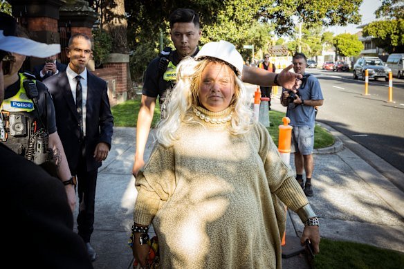 A Gina Rinehart impersonator gets moved on from Raheen after trying, and failing, to enter the party.