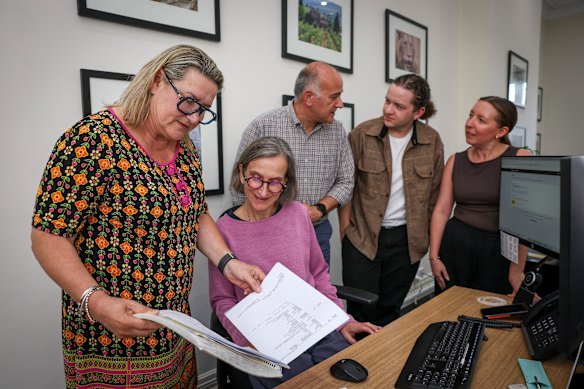 Travel agent Emma Whiting, left, pictured with her team, says travellers can still secure affordable flights to Europe if they are prepared to be flexible. 