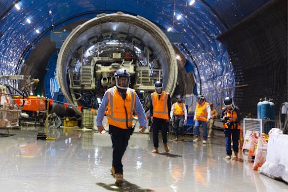 Part of the first 130-metre tunnelling machine to reach the cavern is being slowly pulled apart.