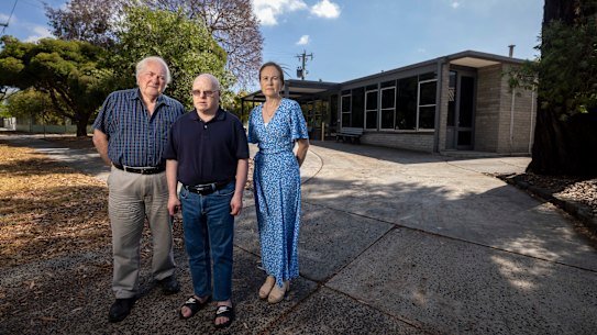 Peter, Damien and Elena Christie outside the Fisher Street Centre in Malvern East.