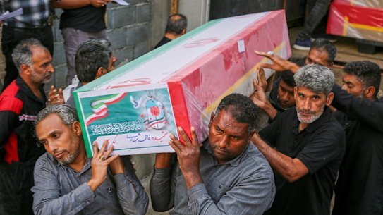 Mourners carry the coffin of one of dozens of children and others killed in an Israeli-US strike on a school in Minab, Iran, on Tuesday.