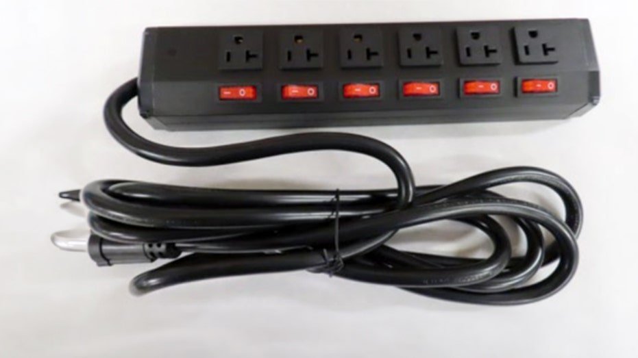 A black power strip with cord.