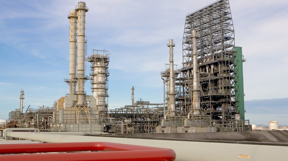 Industrial oil processing equipment and storage tanks stand at the Cerro Negro heavy-oil upgrader facility.