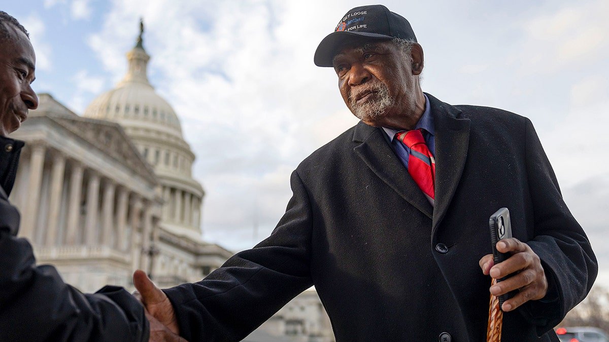 Rep. Danny Davis greets a man outside the U.S. Capitol.