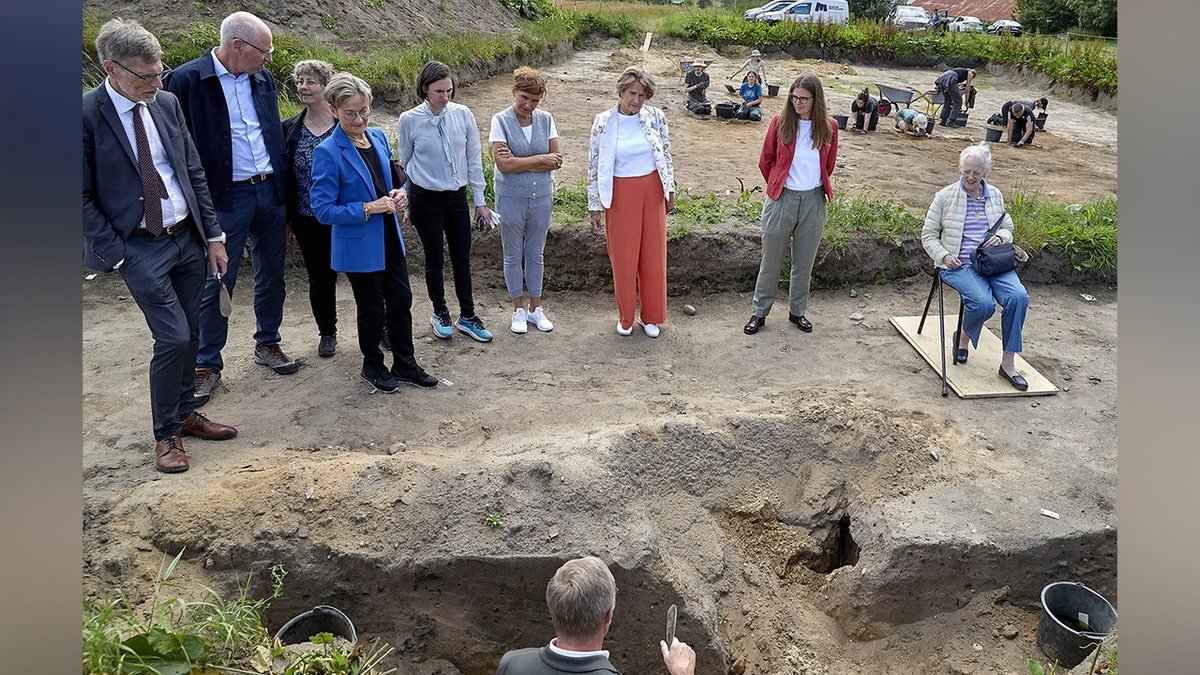 Officials standing near temple site