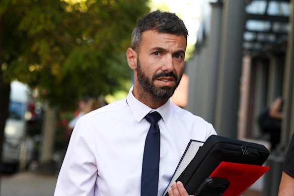 Adrian Bruno leaving Burwood court on Tuesday. The real estate agent has been charged with harassing former colleagues. 