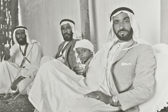Members of the ruling Al Nahyan family drink tea in their palace just outside the city of Abu Dhabi in 1965, with ruler-to-be Sheikh Zayed bin Sultan Al Nahyan at front.