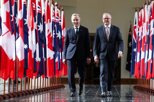 Carney and Albanese exit the House of Representatives after the Canadian prime minister addresses a joint sitting of parliament.