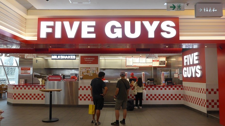 The customer is seen ordering food in an American fast food