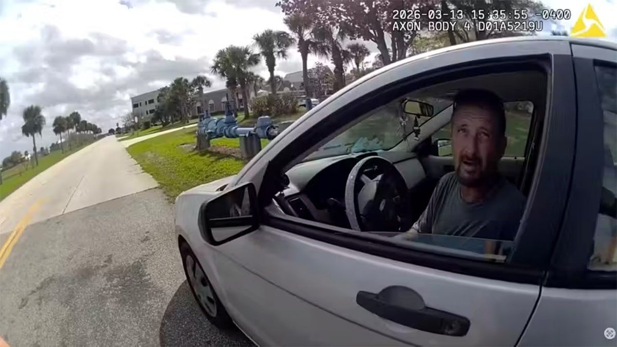 William Murphy III in silver sedan