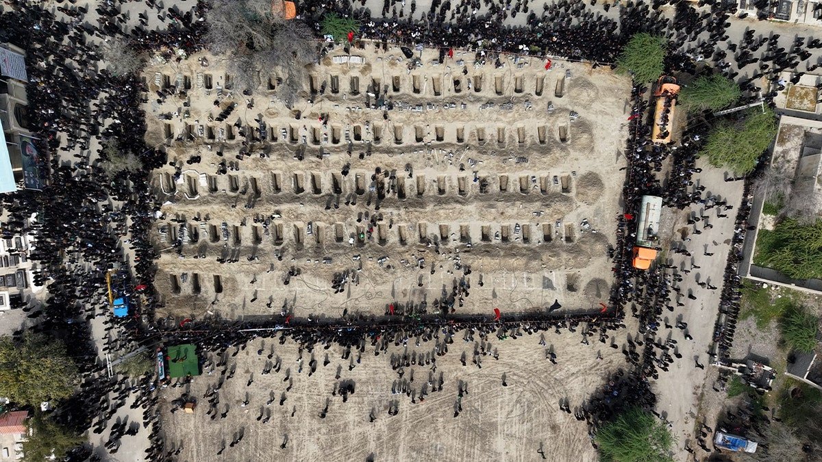 Aerial view of a cemetery in Minab, Iran, where funerals are being held for students and staff killed in a Feb. 28 strike near an IRGC base.