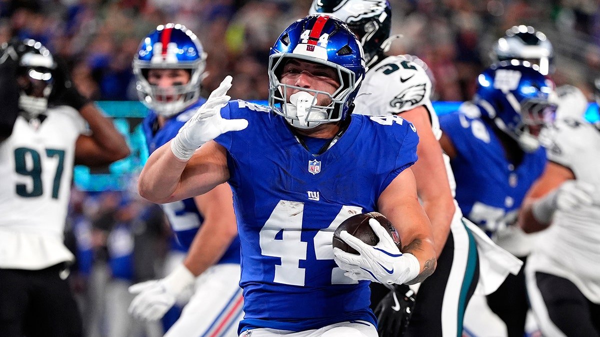 Cam Skattebo scores a touchdown