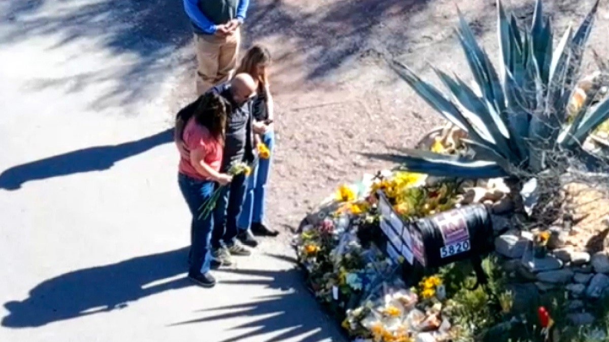Guthrie siblings viewing flowers