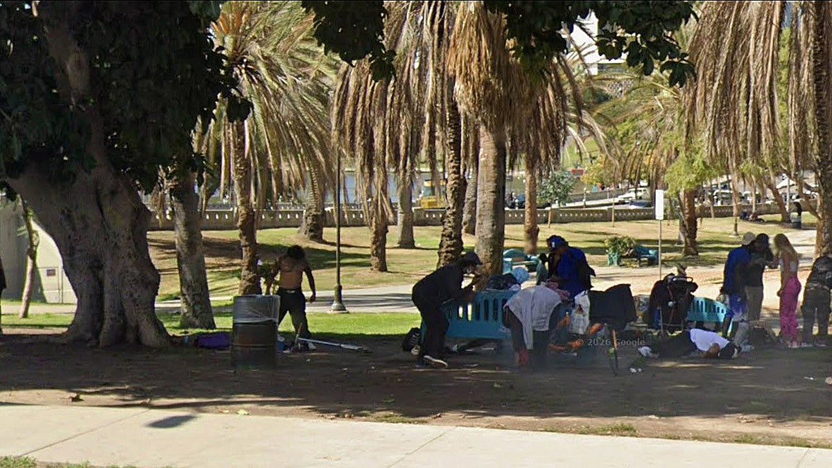 Homeless people surround city park