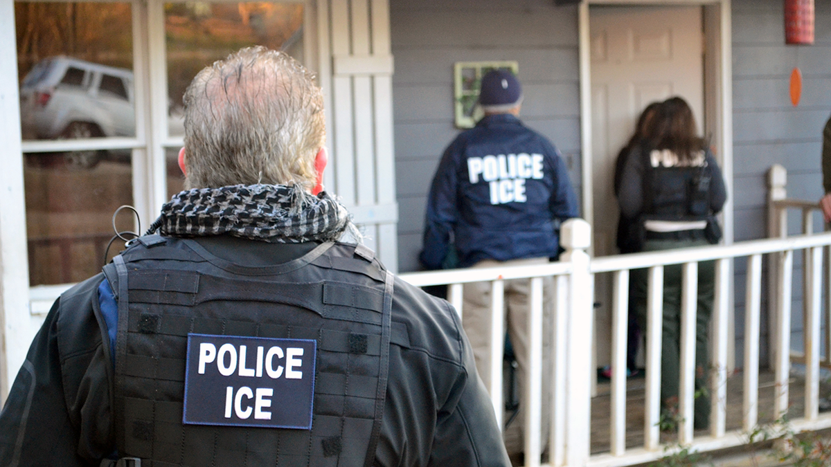 ICE Agents approach a home