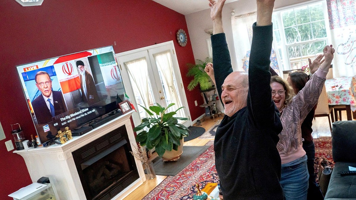 People in Viriginia celebrating as they watch Fox News