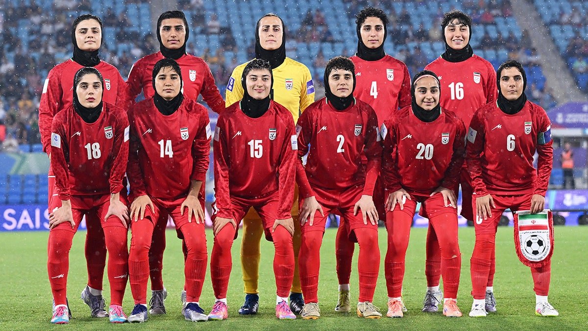 Iran players pose for a team photo