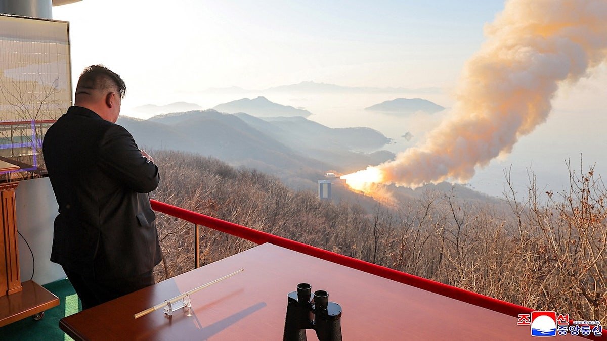 Kim Jong Un watches a rocket engine test