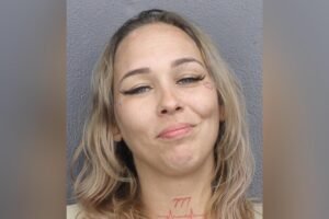 Florida mom with face tattoo grins in mugshot after allegedly trying to murder sister
