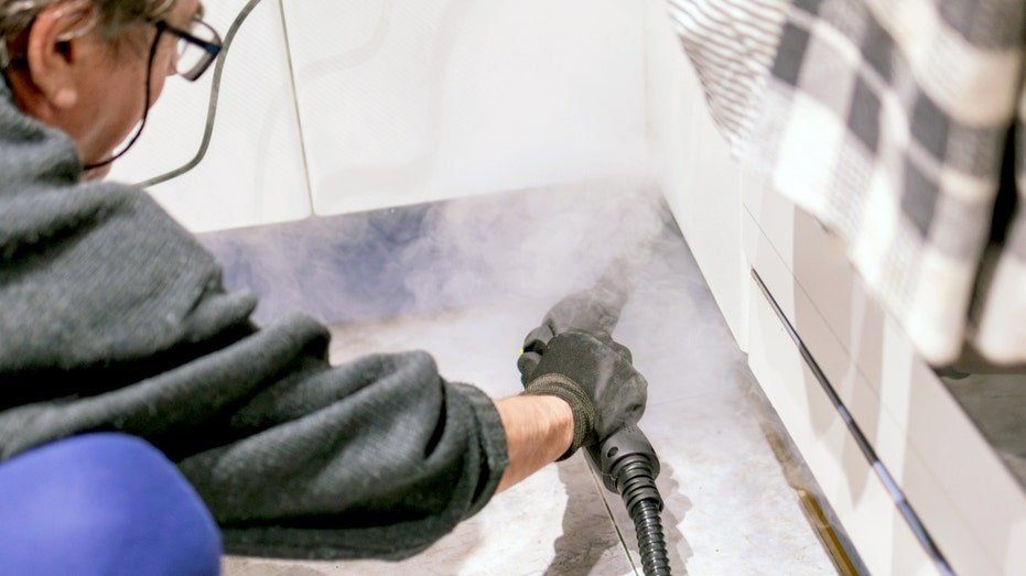 Person using a steamer.